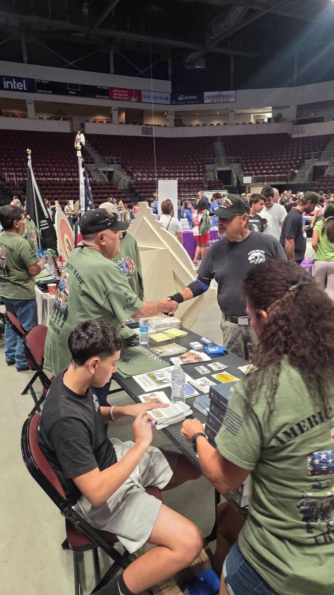 Volunteers sharing resources at the Day of Hope event